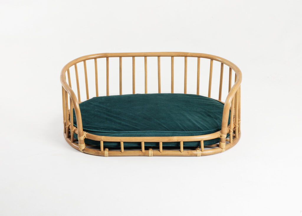 Origo rattan pet bed styled in an elegant interior