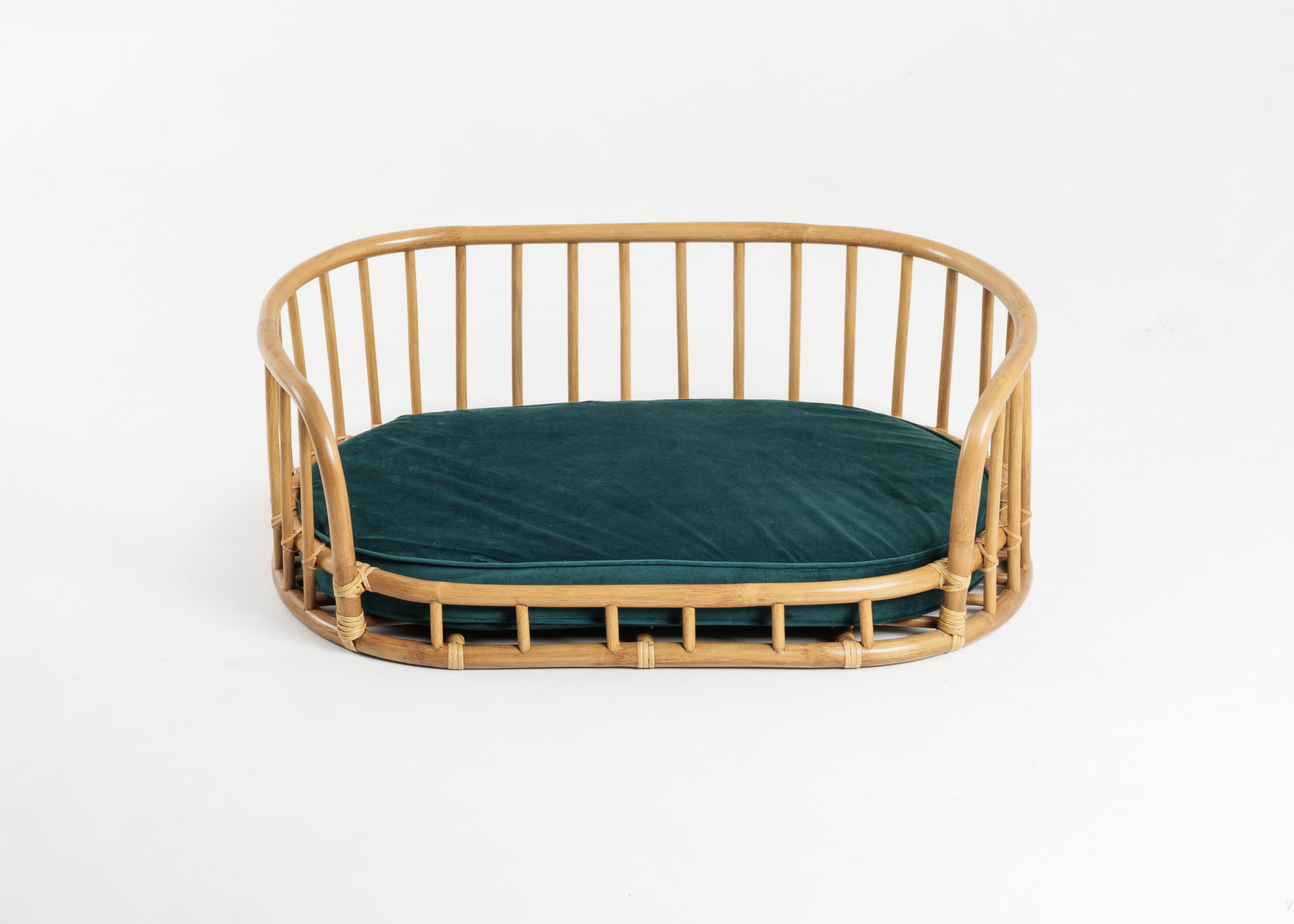 Origo rattan pet bed styled in an elegant interior
